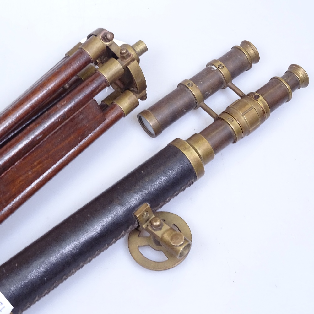 An Antique leather-covered brass telescope with sight, and adjustable brass-mounted wooden tripod by - Image 2 of 2