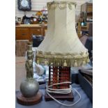 Framed West Java hair accessory, an abacus table lamp, and a brass lamp base, and a bird figure wall