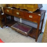 A Campaign style hardwood sideboard, with 3 frieze drawers and shelf below, W137cm, H84cm