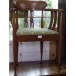 An Edwardian inlaid elbow chair with chequered banding