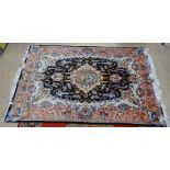 A cream and pink ground Persian design wool carpet, with symmetrical pattern border, 215cm x 155cm