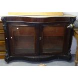 A Victorian mahogany serpentine-front double pier cabinet, with shaped marble top, 2 glazed doors,