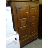 A Continental oak jam cupboard, with 2 panelled doors and drawer under, W110cm, H164cm