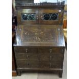 A Liberty Arts and Crafts oak bureau bookcase, possibly Culloden range, with leadlight panelled