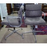 A pair of Charles Eames soft pad chairs, in brown suede, by ICF, with maker's labels and swing tags