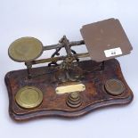 A brass and oak postal scale and weights, 30.5cm