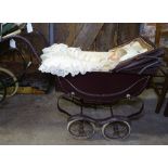 A small coach built Silver Cross pram and doll