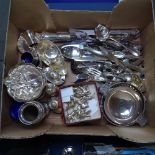 A box containing plated cutlery, elephant menu holders, cruets etc