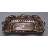 A Victorian embossed and pierced silver pin tray, length 17cm, hallmarks London 1899