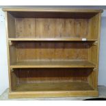 A polished pine 3-tier open bookcase, W101cm, H94cm