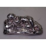 A Sevres silver-clad paperweight in the form of a sleeping boy