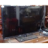 A Panasonic 32" flat screen television, with a Panasonic DVD player, and remotes, GWO