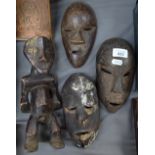 3 old miniature African masks, and an African figure, 27cm