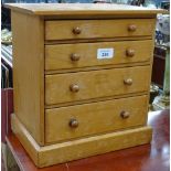 A polished pine chest of 4 long graduated drawers, height 32cm
