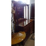 An Art Nouveau walnut mirror-back sideboard, base fitted with 2 frieze drawers and carved panelled