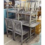 A weathered slatted teak rectangular garden table, together with 6 chairs, and a galvanised watering