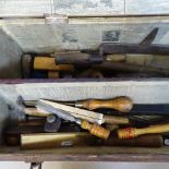 A stained wood tool chest, containing tools and rules