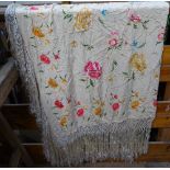 An embroidered silk shawl with floral decoration