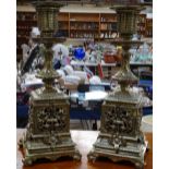 A pair of cast and pierced gilt-brass candlesticks, 25cm