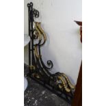 A pair of scrolled wrought-iron wall brackets