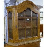 An oak hanging cabinet with lattice glazed door, W65cm