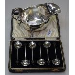 A cased set of 6 silver bean-end coffee spoons, and a silver sauce boat