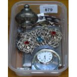 A silver cigarette case, a silver-cased desk clock, a nurse's buckle etc