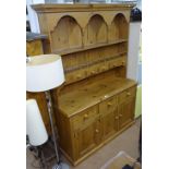 A large modern polished pine 2-section kitchen dresser, W142cm, H200cm