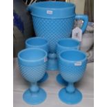 A blue milk glass water set