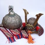 A Turkmenistan Wedding Helmet and Japanese brass decorative helmet.