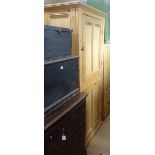 A large pine cupboard with 2 panelled doors, W97cm, H199cm