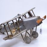 A tinplate bi-plane, length 50cm, converted to a table lamp
