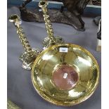 A copper and brass dish, and a pair of barley twist brass candlesticks, 25cm