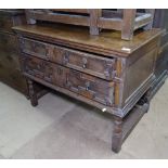An 18th century oak chest in Jacobean style, with 2 long drawers on turned legs, W94cm, H71cm