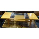 A mid-century teak 2-tier coffee table with glass panel, W137cm, H43cm, D51cm