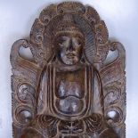 A carved stained wood Buddha, 48cm