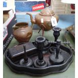 An ebony dressing table set, a copper kettle on tripod supports, and a copper jug