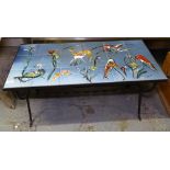 A mid-century tiled-top coffee table, signed, on a scrolled wrought-iron base