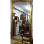 A large modern gilt-framed rectangular wall mirror, L265cm, H145cm