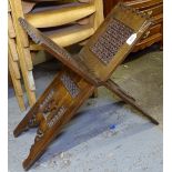 A carved and pierced stained pine Korin stand