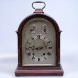 A dome-top mantel clock with 2-train movement, and 3 dials, and brass carrying handle, height 34cm