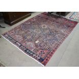 A red ground Iranian carpet, with symmetrical pattern, 248cm x 170cm