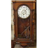 An oak-cased 2-train wall clock, 85cm