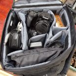 A Canon camera and accessories, binoculars etc