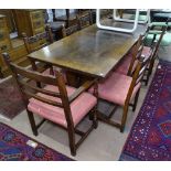 An Ipswich oak design rectangular oak refectory dining table, raised on pierced tablet ends,