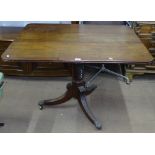 A Regency mahogany rectangular tilt-top dining table, on spiral turned column and tripod base,