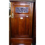 An Edwardian walnut bedside cupboard, with carved panelled door, W38cm