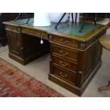 A Chippendale style mahogany partners' writing desk, with fitted drawers and cupboard, reeded canted
