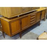 A mid-century G-Plan teak fresco cross-banded sideboard, with fitted drawers and cupboards,