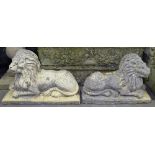 A pair of opposing weathered concrete recumbent lions, L60cm, H40cm